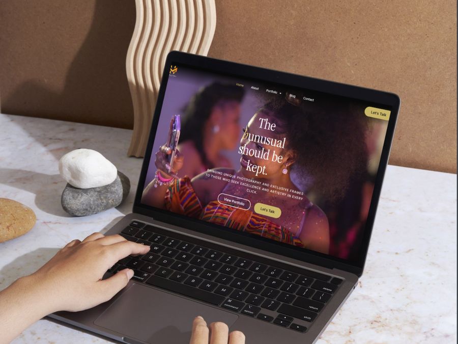 Hunusual Media photography website shown on laptop